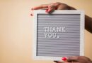hands holding thank you sign