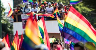 Pride Parade with floats and flags