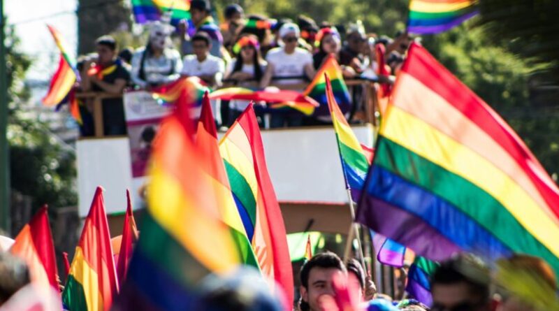 Pride Parade with floats and flags