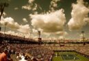 tennis court, tennis, stadium, audience, crowd, sport, competition, event, championship, green, match, player, versus, people, grunge, court, nature, spectators, sports, net, rogers centre, sky, clouds, athletes, flags, brown crowd, brown sports, brown event